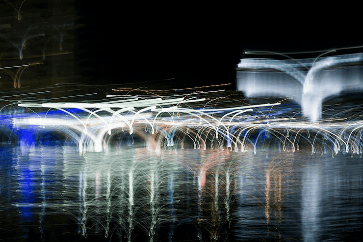 Lighting solutions with dynamic light trails and reflections at night.