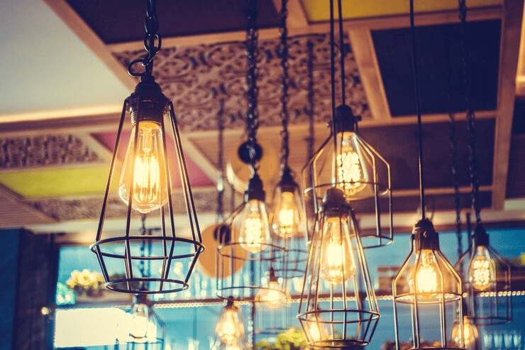 Elegant hanging pendant lighting fixtures with vintage Edison bulbs.